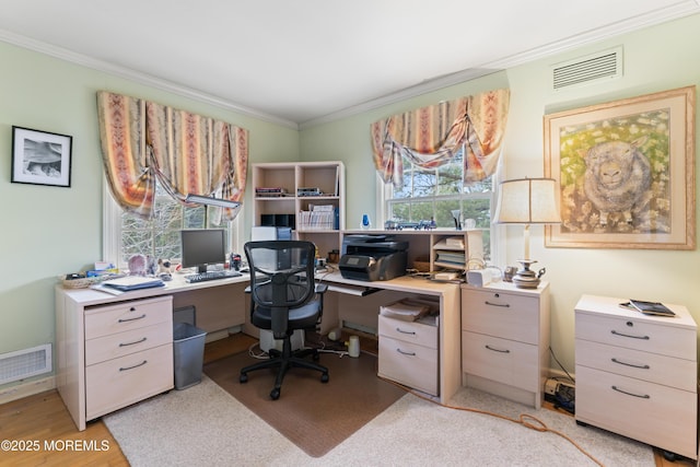 office area with light wood-style floors, visible vents, and ornamental molding