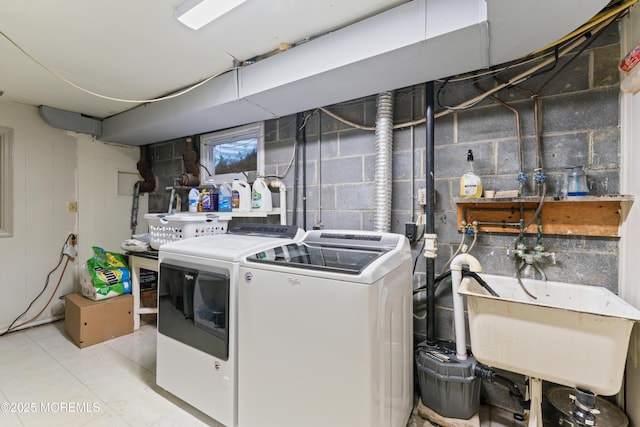 laundry area with washer and dryer, laundry area, and a sink