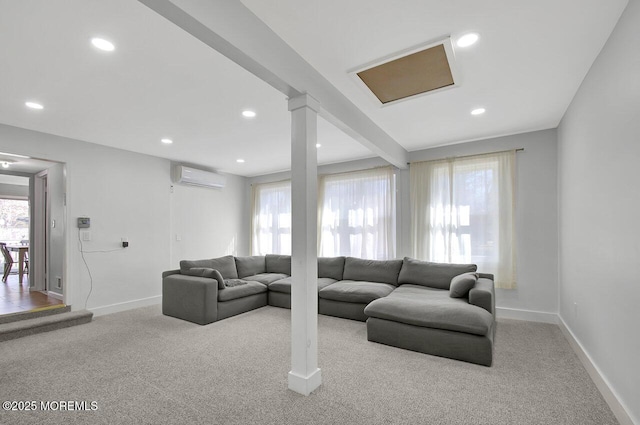 living area with a wall unit AC, baseboards, and recessed lighting