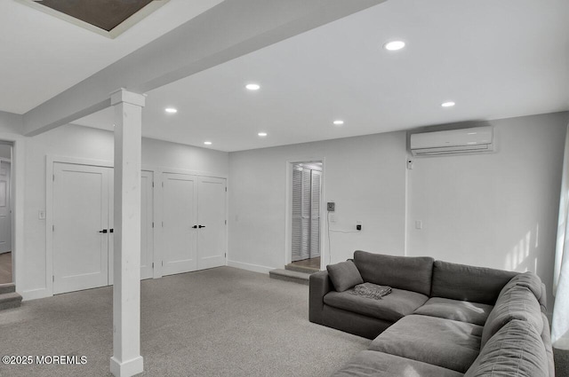 living room with baseboards, an AC wall unit, decorative columns, and recessed lighting