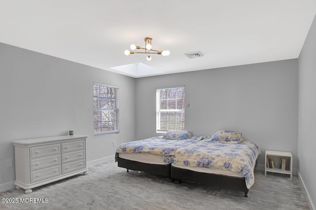 bedroom with a chandelier, carpet, visible vents, and baseboards