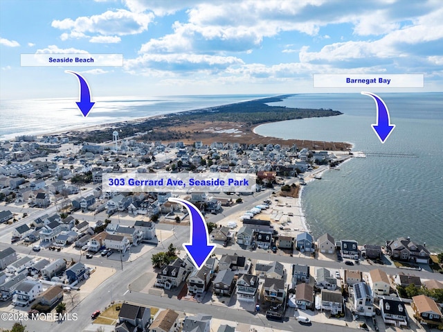 bird's eye view featuring a water view and a residential view