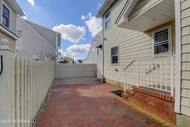 view of patio featuring fence