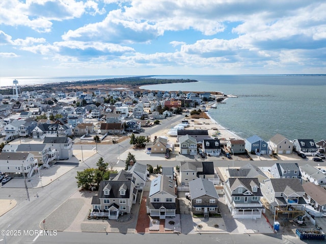 birds eye view of property featuring a water view and a residential view