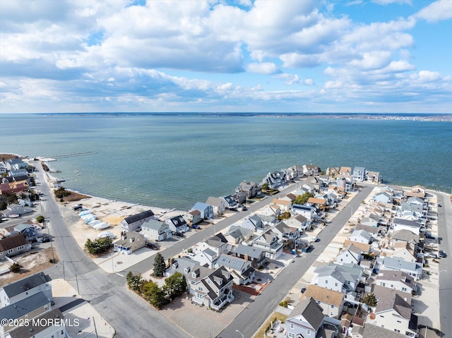 birds eye view of property featuring a residential view and a water view