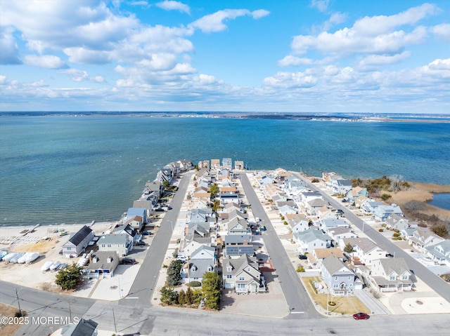 bird's eye view with a water view and a residential view