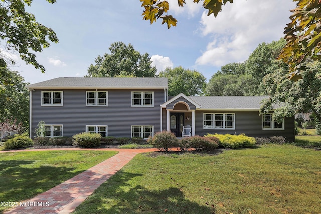 tri-level home featuring a front lawn