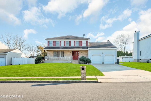 view of front of home with brick siding, an attached garage, fence, driveway, and a front lawn