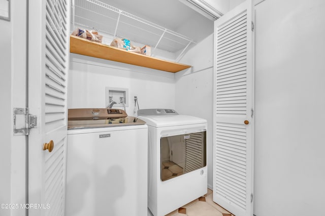 clothes washing area with laundry area and separate washer and dryer