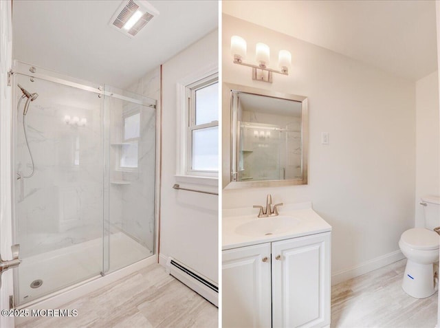 bathroom featuring visible vents, toilet, a baseboard heating unit, a marble finish shower, and vanity