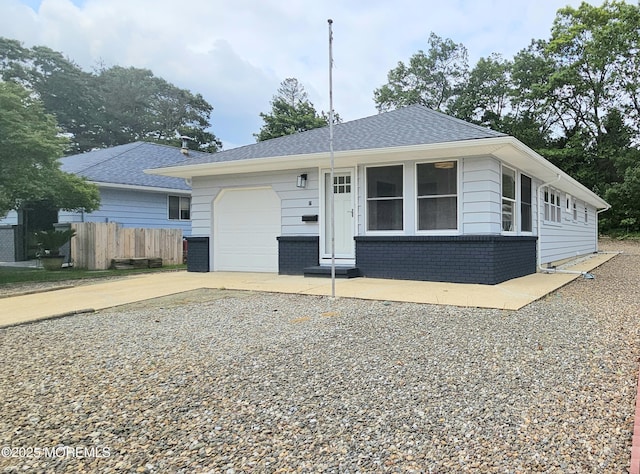 16 Mount Kisco Dr, Toms River, NJ 08753 - view of front facade featuring a garage, driveway, brick siding, and roof with shingles