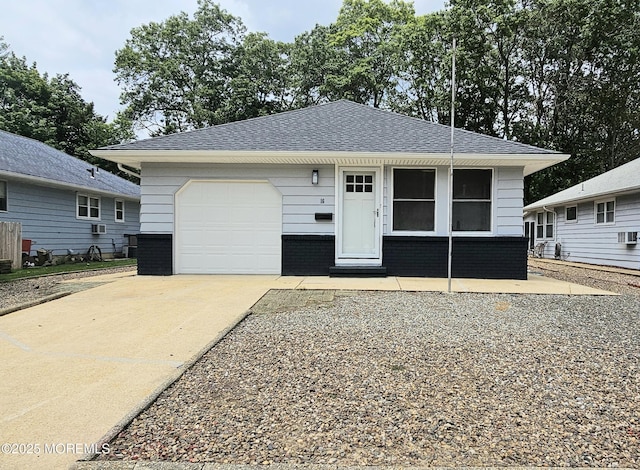 16 Mount Kisco Dr, Toms River, NJ 08753 - view of front facade featuring a garage, concrete driveway, a shingled roof, and brick siding