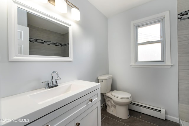 full bath with toilet, vanity, baseboard heating, and tile patterned floors