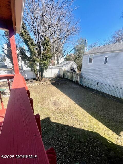 view of yard with a fenced backyard