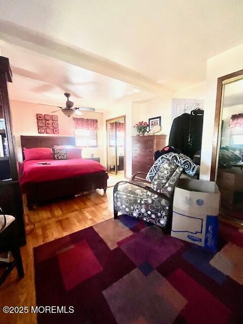 bedroom featuring a ceiling fan and wood finished floors