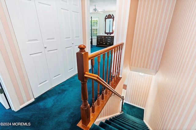 stairs with carpet floors and wallpapered walls