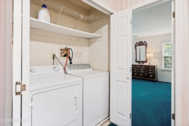 clothes washing area featuring wallpapered walls, laundry area, independent washer and dryer, a textured ceiling, and carpet floors