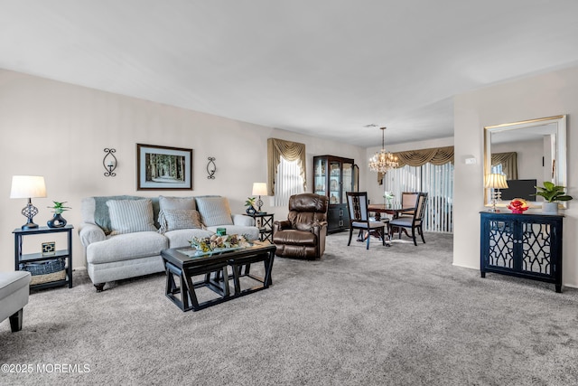 living room featuring a chandelier and carpet