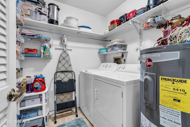 laundry room featuring light tile patterned floors, laundry area, electric water heater, and washer and dryer