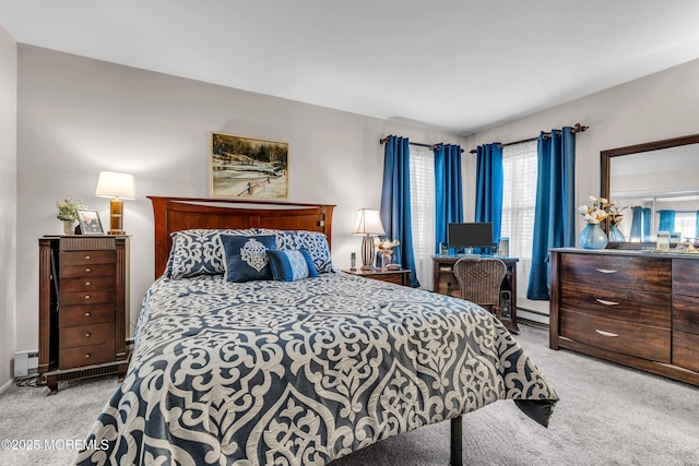 bedroom featuring light carpet and a baseboard radiator