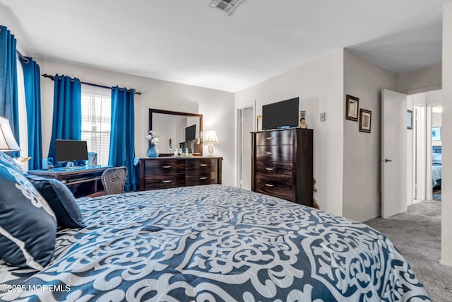 carpeted bedroom with visible vents