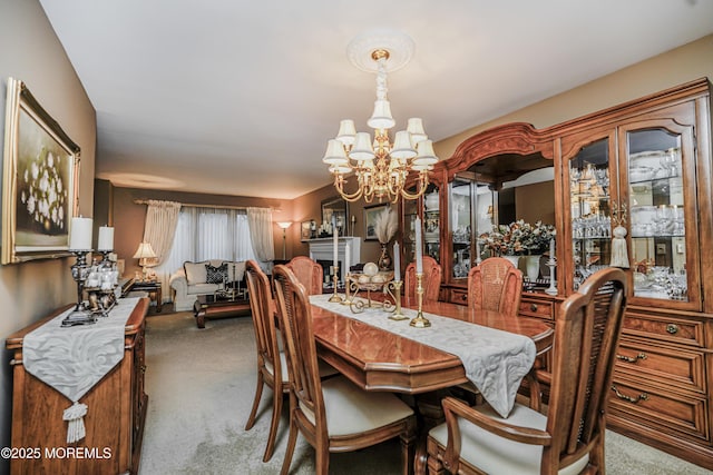 dining area with carpet flooring and an inviting chandelier