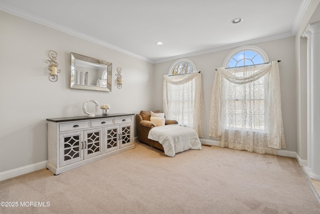 sitting room with baseboards, carpet floors, decorative columns, and crown molding