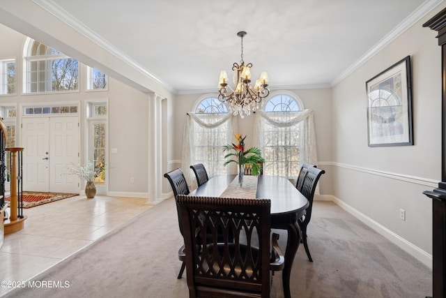 dining space featuring light carpet, ornate columns, light tile patterned flooring, and crown molding