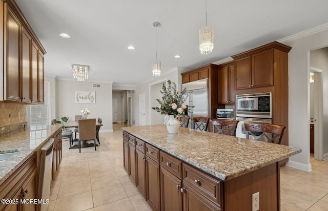 kitchen with built in appliances, light tile patterned floors, and crown molding