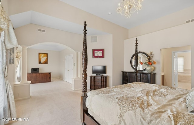 carpeted bedroom featuring arched walkways, baseboards, visible vents, and ornate columns