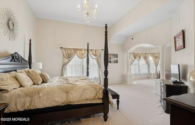 carpeted bedroom with arched walkways, a notable chandelier, visible vents, baseboards, and decorative columns