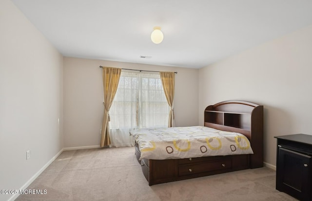 bedroom with light carpet, baseboards, and visible vents