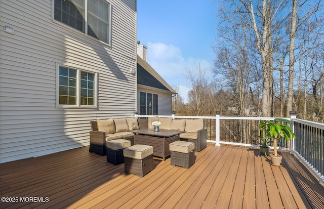 wooden deck featuring an outdoor living space