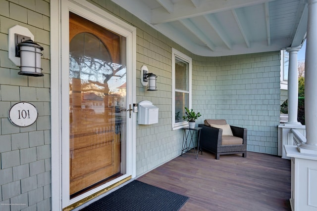 doorway to property featuring a porch