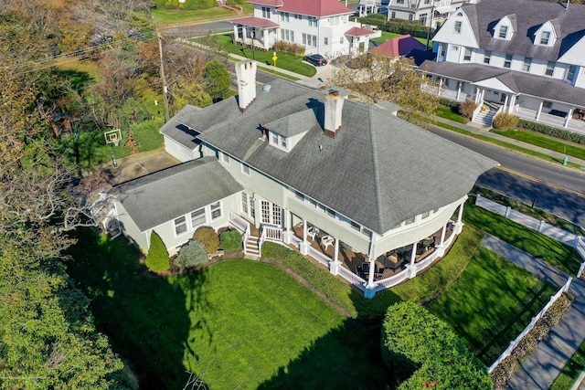 birds eye view of property with a residential view