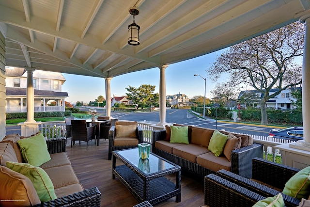 wooden deck with a residential view and an outdoor hangout area