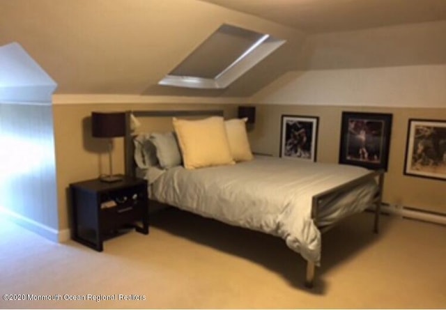 bedroom featuring vaulted ceiling and carpet