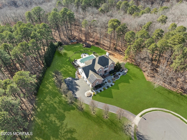 bird's eye view with a forest view