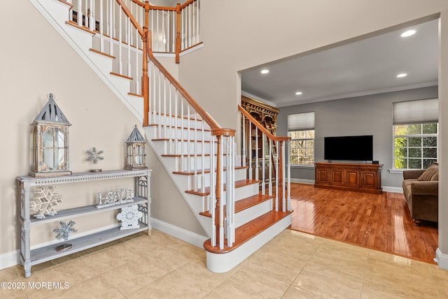 stairs featuring ornamental molding, recessed lighting, baseboards, and tile patterned floors