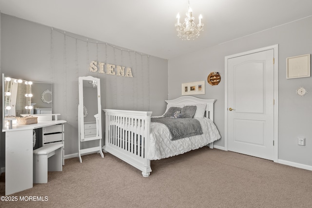 carpeted bedroom featuring a chandelier and baseboards