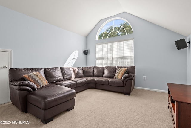 living area with light carpet, baseboards, and lofted ceiling