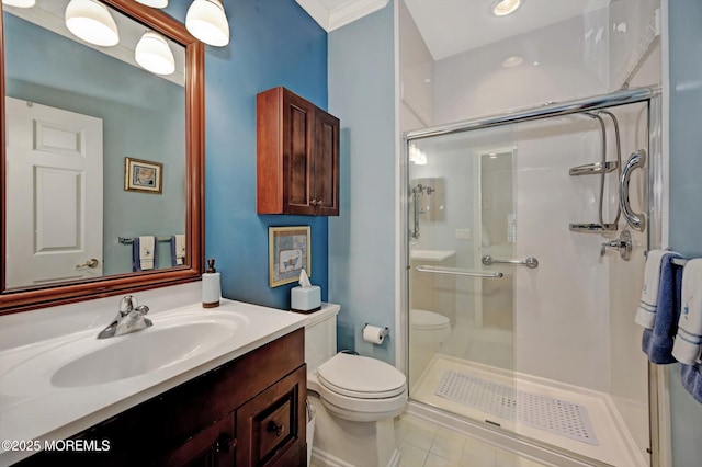 bathroom with tile patterned floors, a shower stall, toilet, and vanity