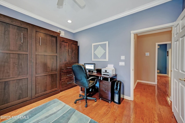 office space featuring light wood finished floors, visible vents, ornamental molding, a ceiling fan, and baseboards