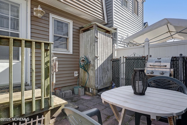 view of patio featuring fence