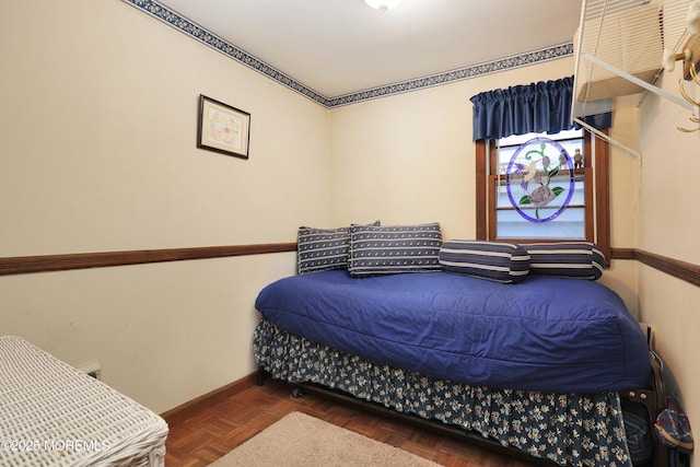 bedroom featuring baseboards