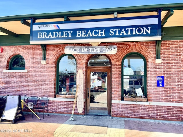 entrance to property with brick siding