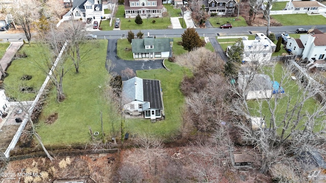 birds eye view of property with a residential view