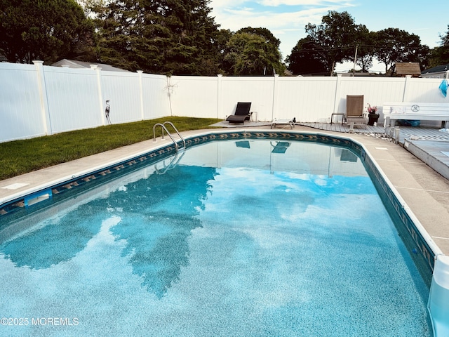 view of pool featuring a fenced backyard, a fenced in pool, and a patio