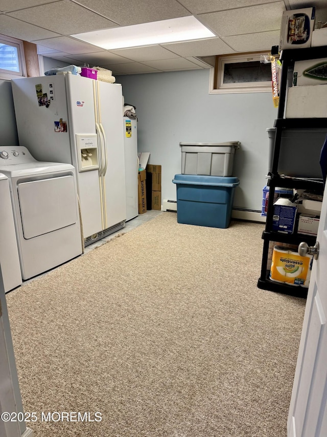 washroom with laundry area, carpet, baseboard heating, and separate washer and dryer