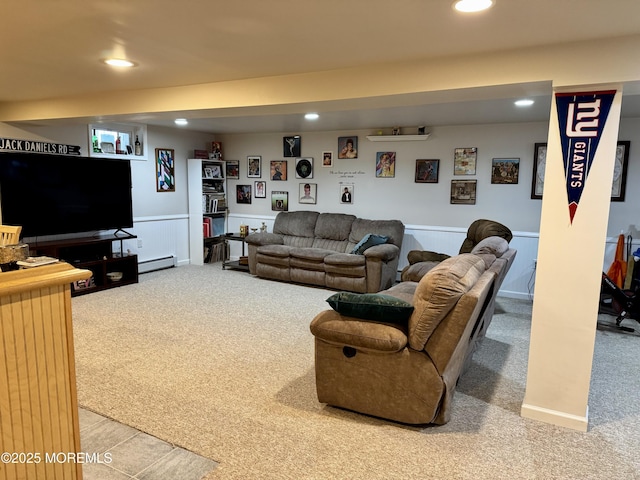 carpeted living room with a baseboard heating unit, recessed lighting, and wainscoting